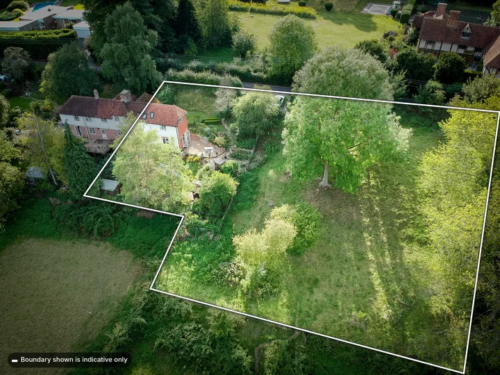 Aerial view of the cottage and its grounds, with the plot outlined in white